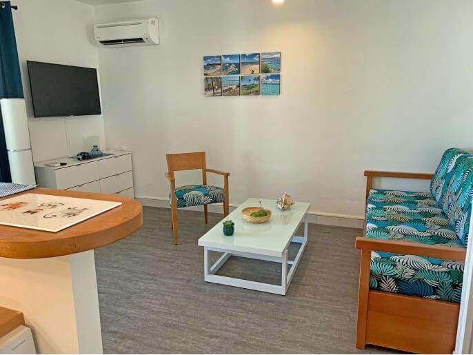 Location VillaAppartement en Guadeloupe - Salon avec canapé lit