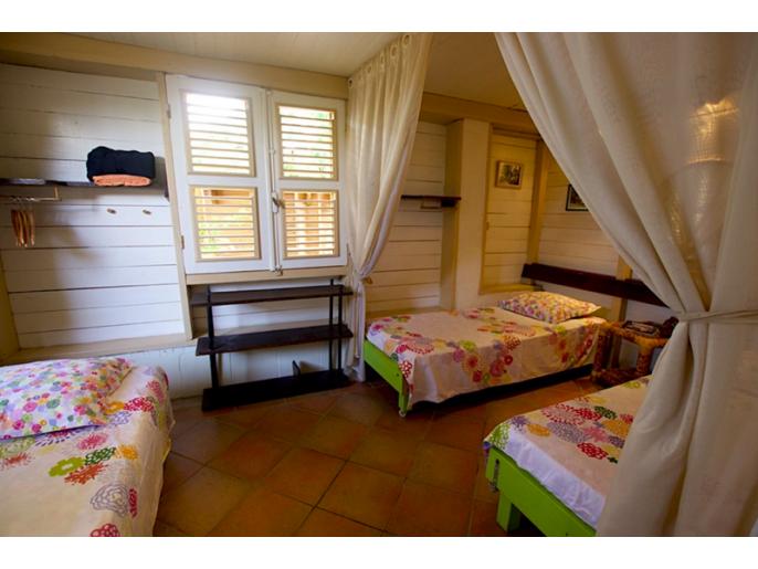 Location VillaMaison/Appartement en Guadeloupe - La chambre secondaire en version triple