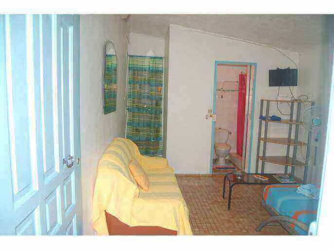 Location VillaMaison/Appartement en Guadeloupe - chambre avec tv